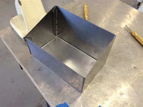 a metal worker is making a box|how to make a metal box.